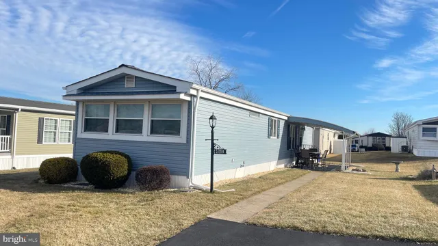 a front view of a house with parking space