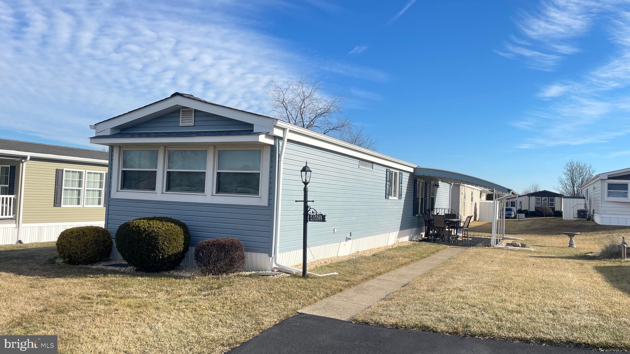 a front view of a house with parking space