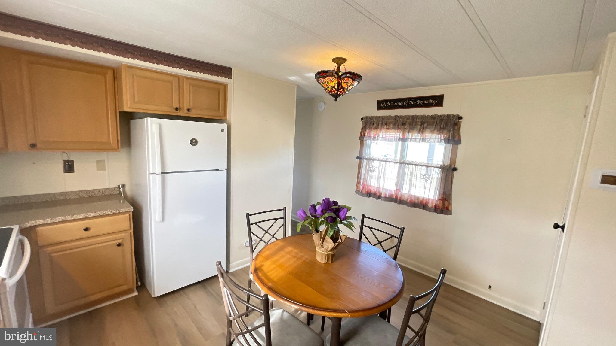 461 Running Brook Road North Wales, PA 19454 - Photo 12 of 19 a kitchen with stainless steel appliances refrigerator stove and table
