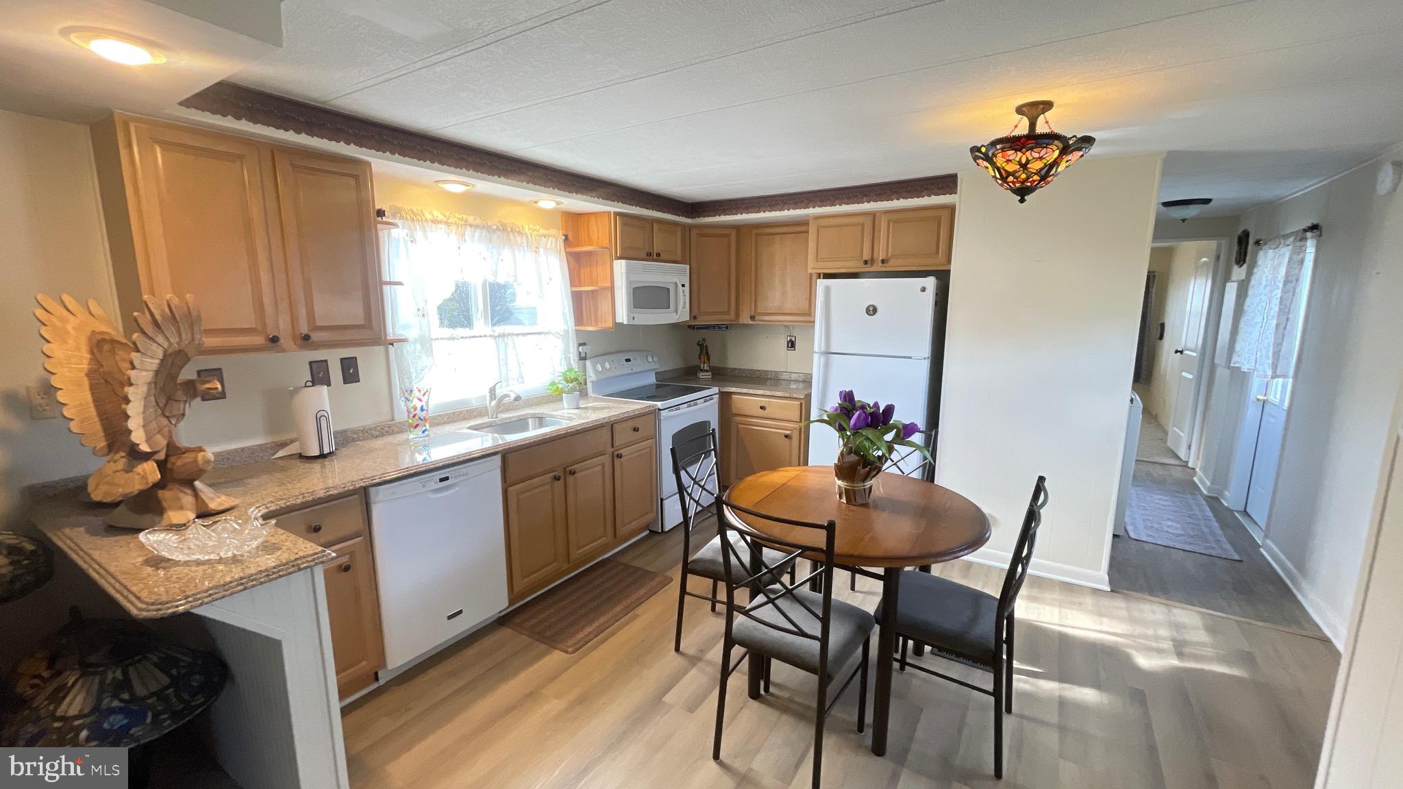 461 Running Brook Road North Wales, PA 19454 - Photo 13 of 19 a large kitchen with a table and chairs in it