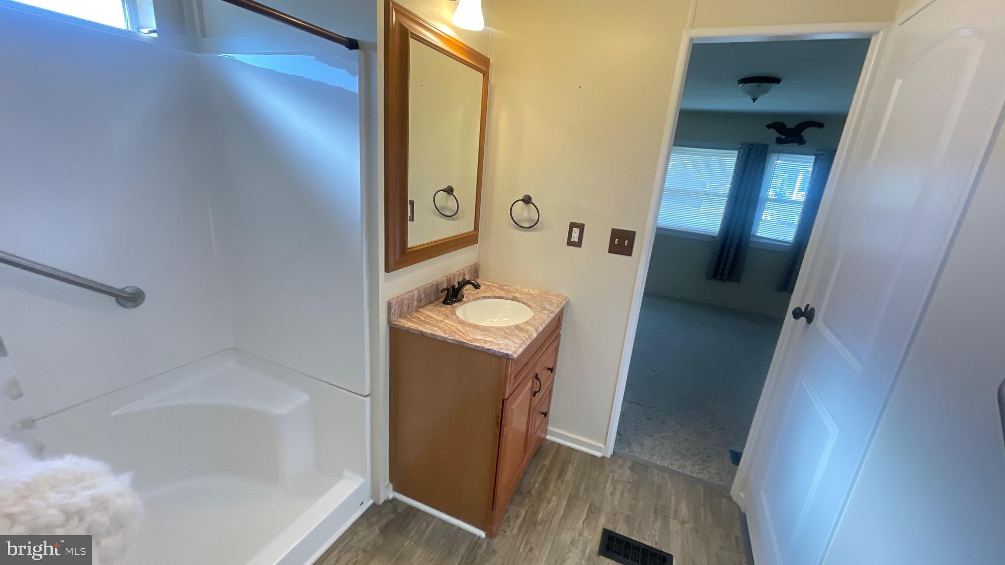 461 Running Brook Road North Wales, PA 19454 - Photo 10 of 19 a bathroom with a tub sink and mirror
