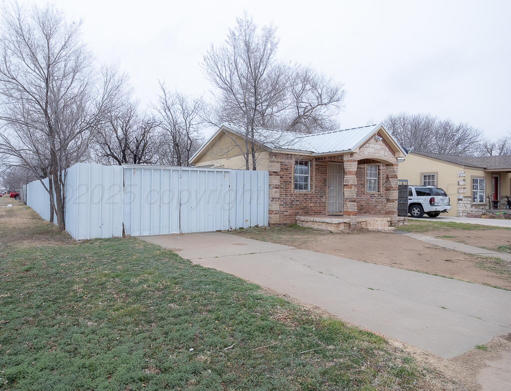 2501 Spruce Street Amarillo, TX 79103 - Photo 14 of 15 a view of a yard with wooden fence