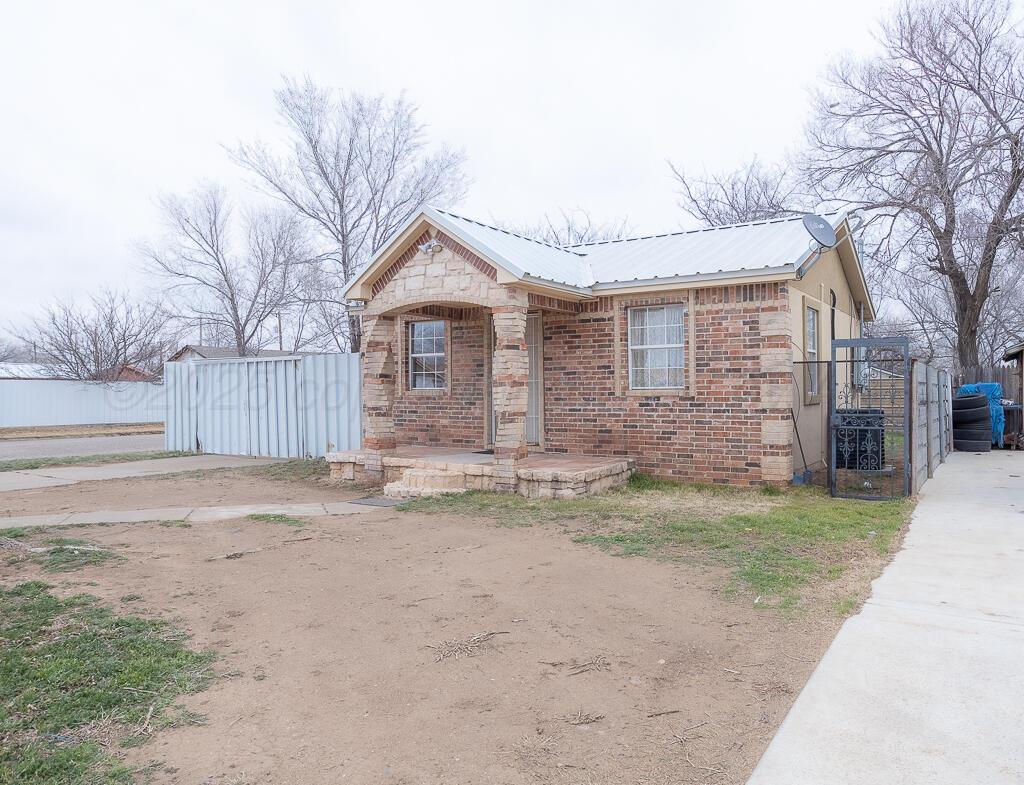 2501 Spruce Street Amarillo, TX 79103 - Photo 15 of 15 a front view of a house with a yard and garage