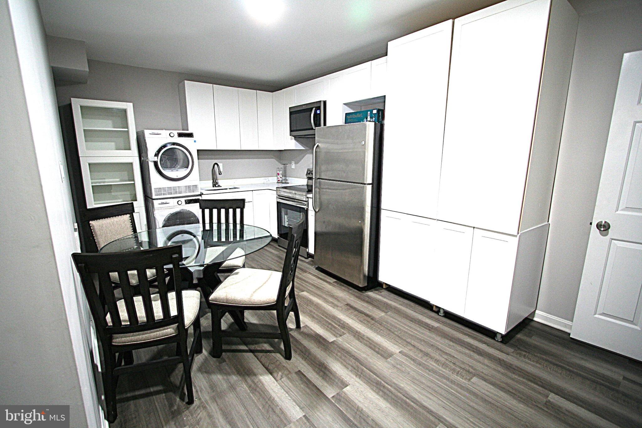 13017 Broadmore Road Silver Spring, MD 20904 - Photo 45 of 79 Stacked Washer Dryer. Storage Cabinet