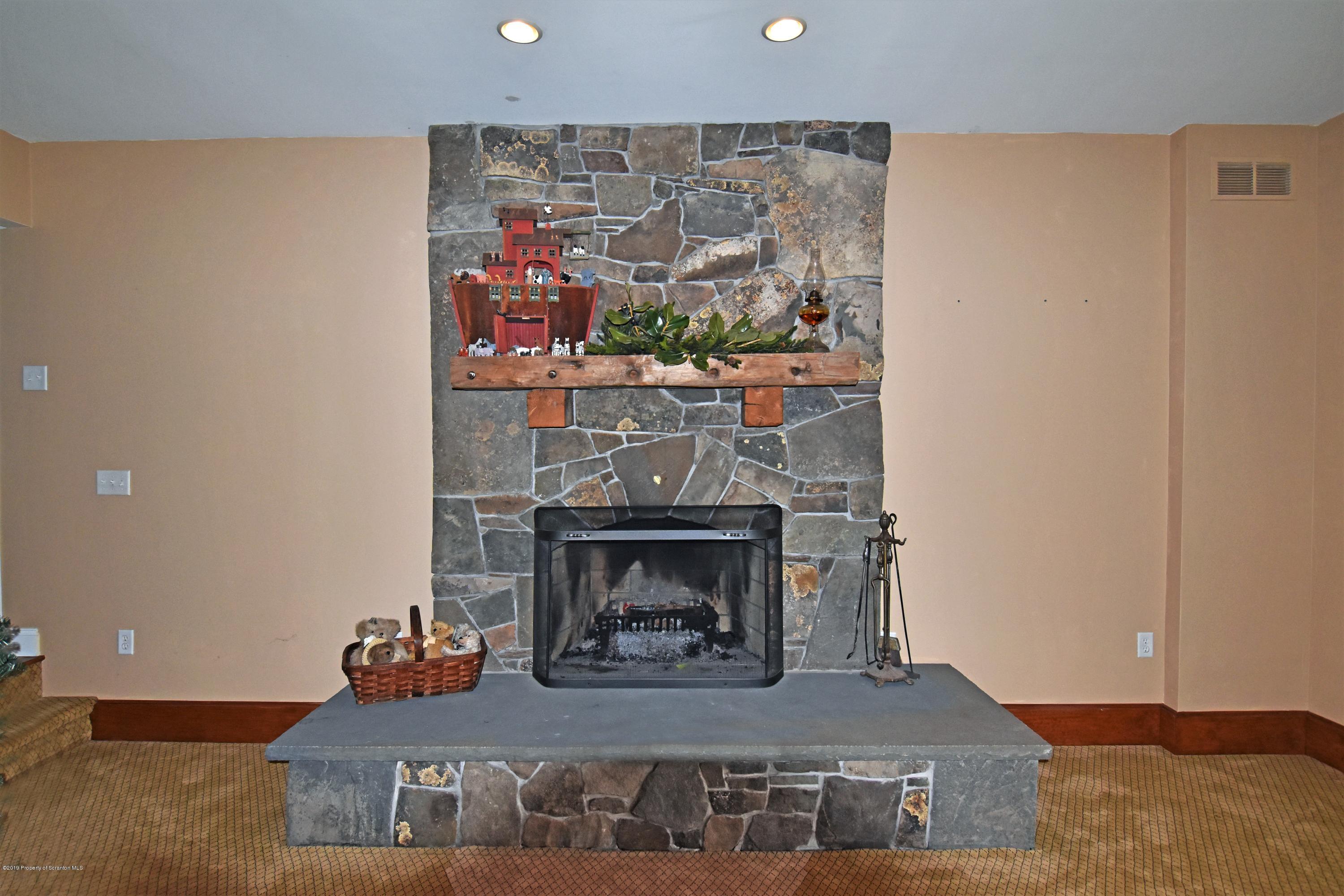 505 Spadine Road Nicholson, PA 18446 - Photo 13 of 38 a living room with furniture and a fireplace