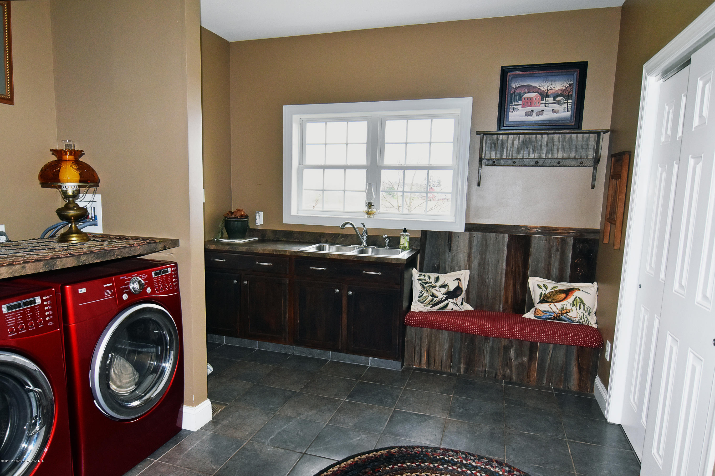 505 Spadine Road Nicholson, PA 18446 - Photo 35 of 38 a utility room with painting on the wall and a window