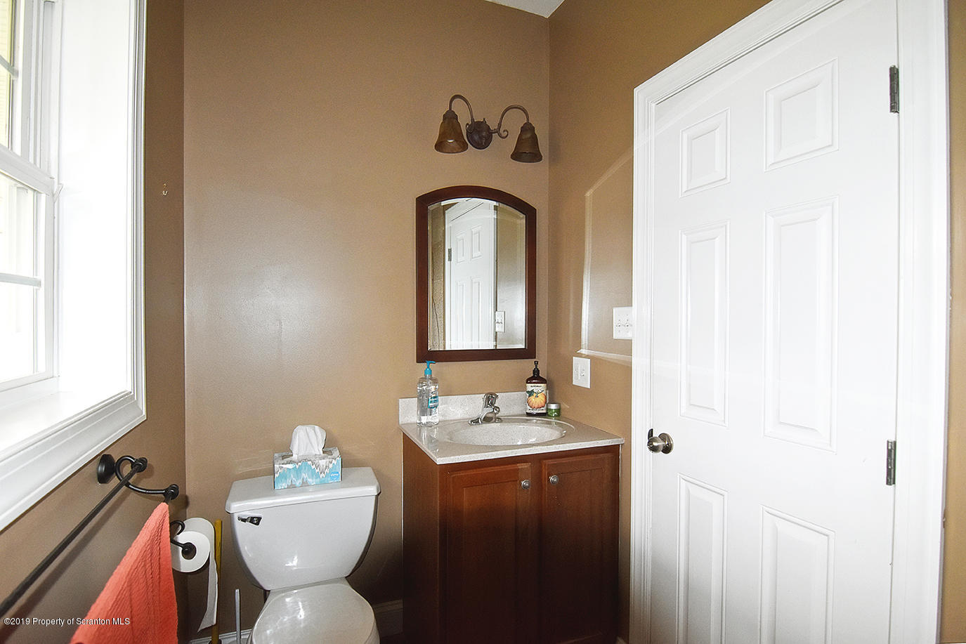 505 Spadine Road Nicholson, PA 18446 - Photo 36 of 38 a bathroom with a sink and mirror with toilet