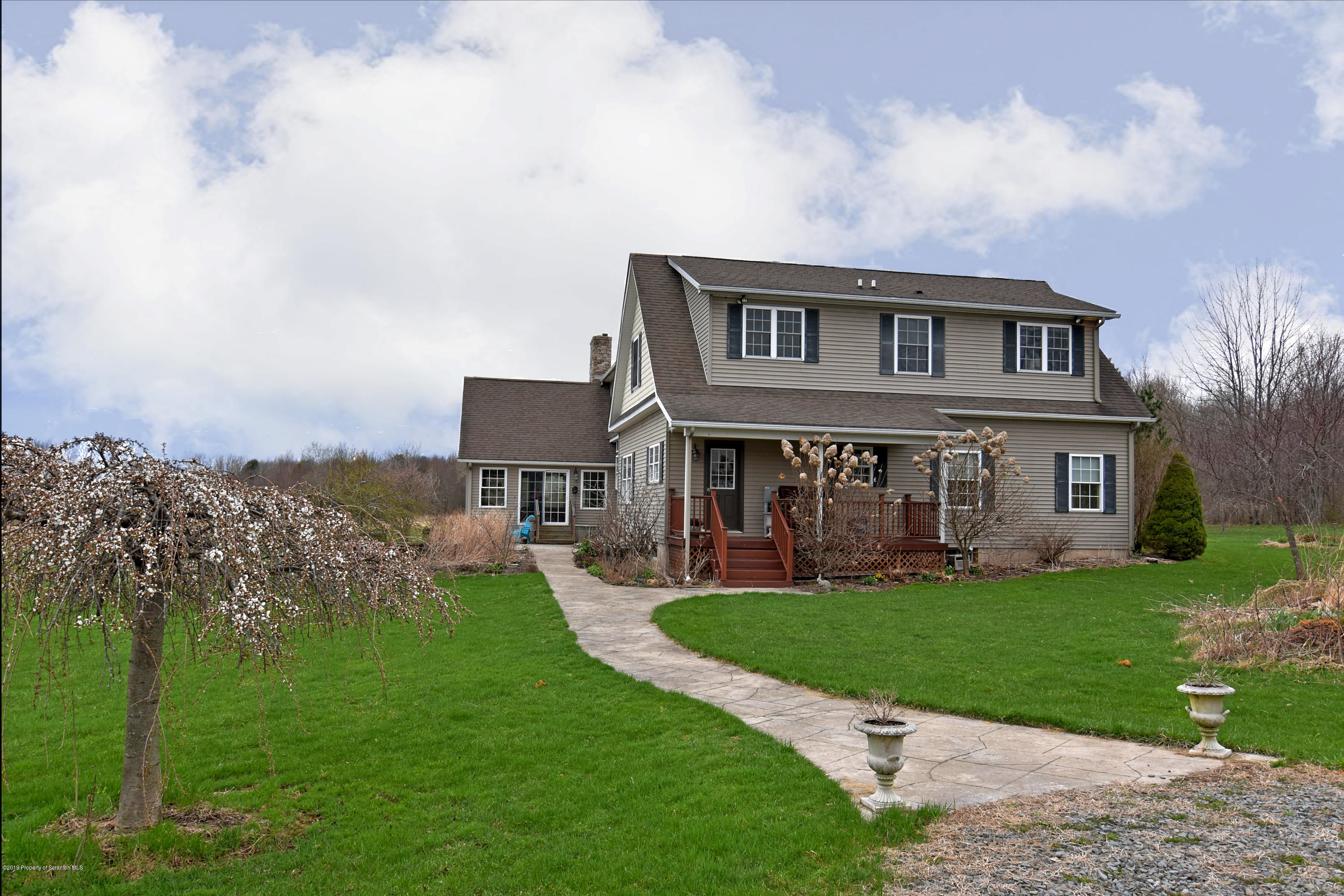 505 Spadine Road Nicholson, PA 18446 - Photo 4 of 38 a front view of a house with a yard