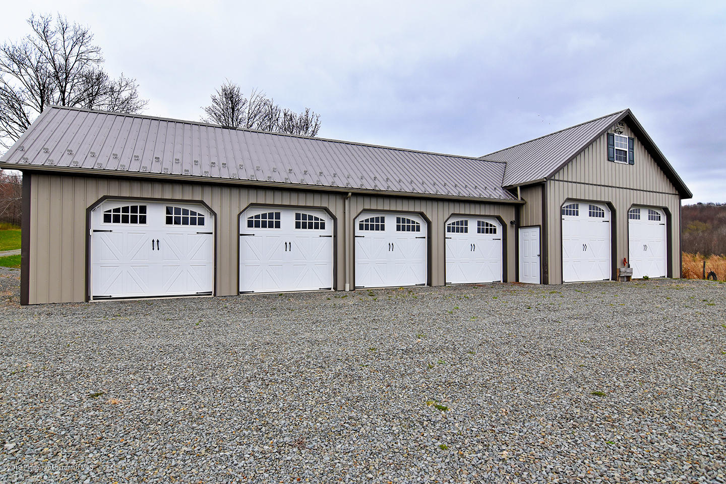 505 Spadine Road Nicholson, PA 18446 - Photo 5 of 38 a front view of a house with a yard and garage