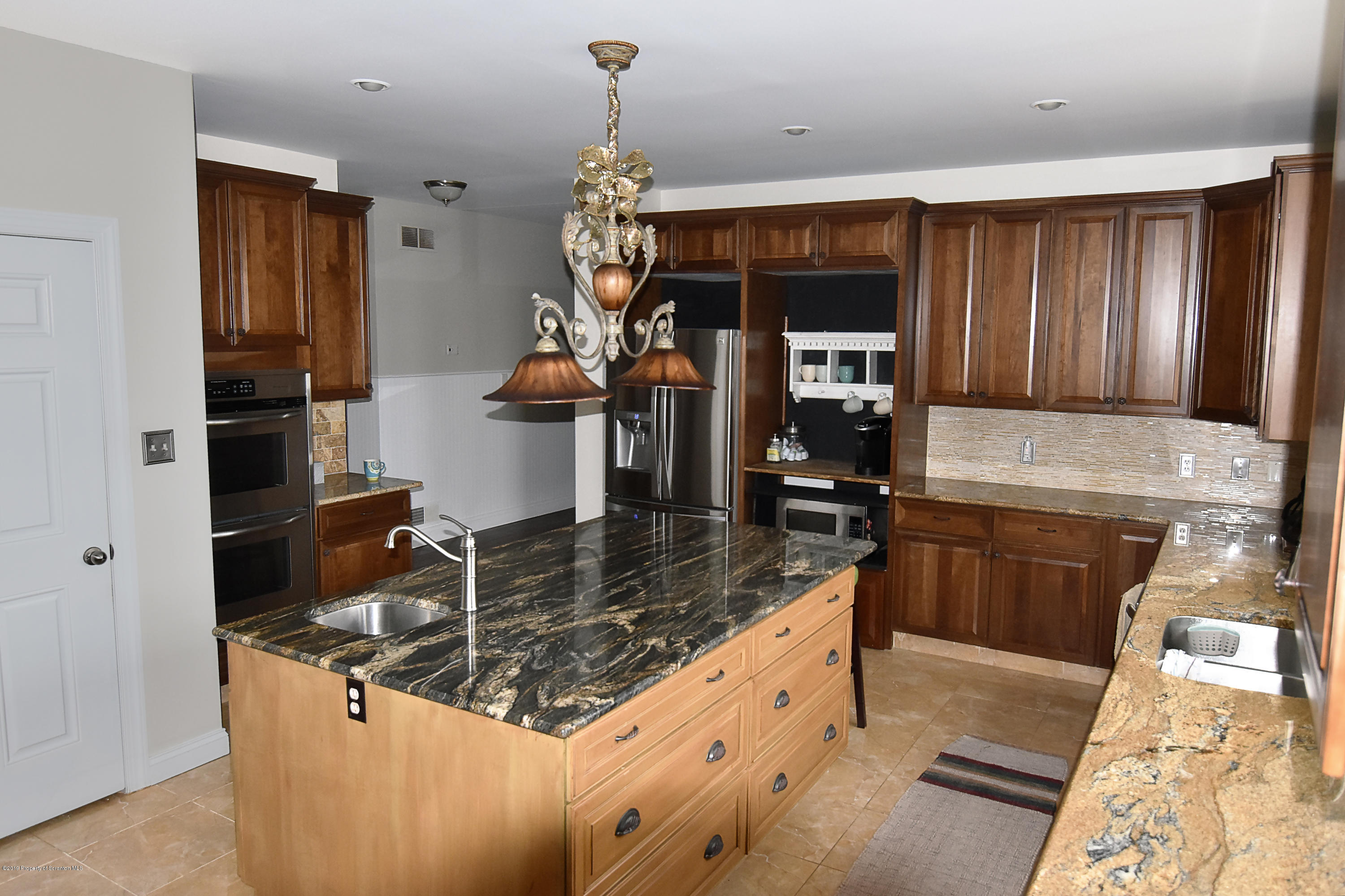 505 Spadine Road Nicholson, PA 18446 - Photo 6 of 38 a kitchen with stainless steel appliances granite countertop a sink and a refrigerator