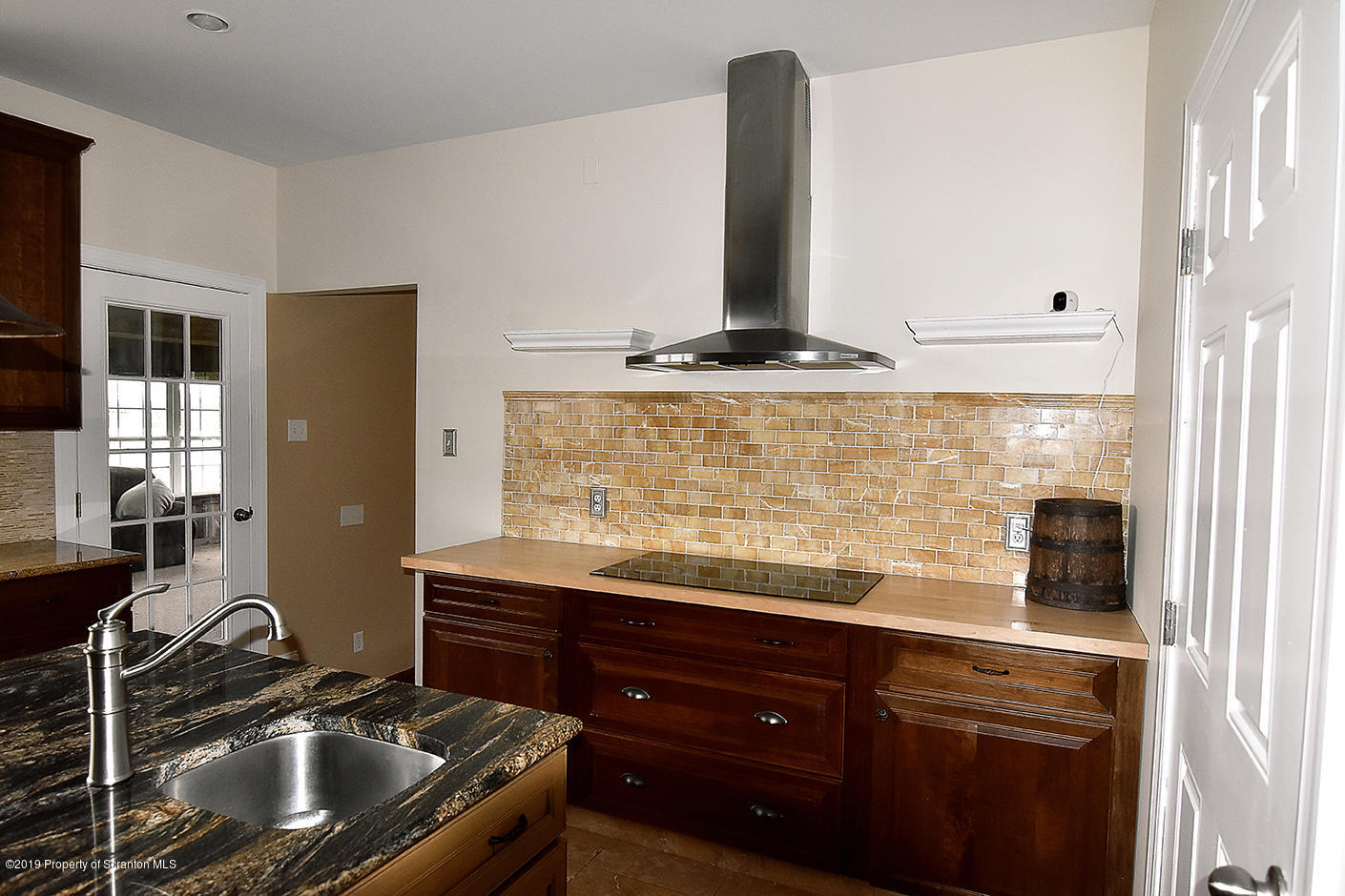 505 Spadine Road Nicholson, PA 18446 - Photo 10 of 38 a kitchen with granite countertop a sink and a stove