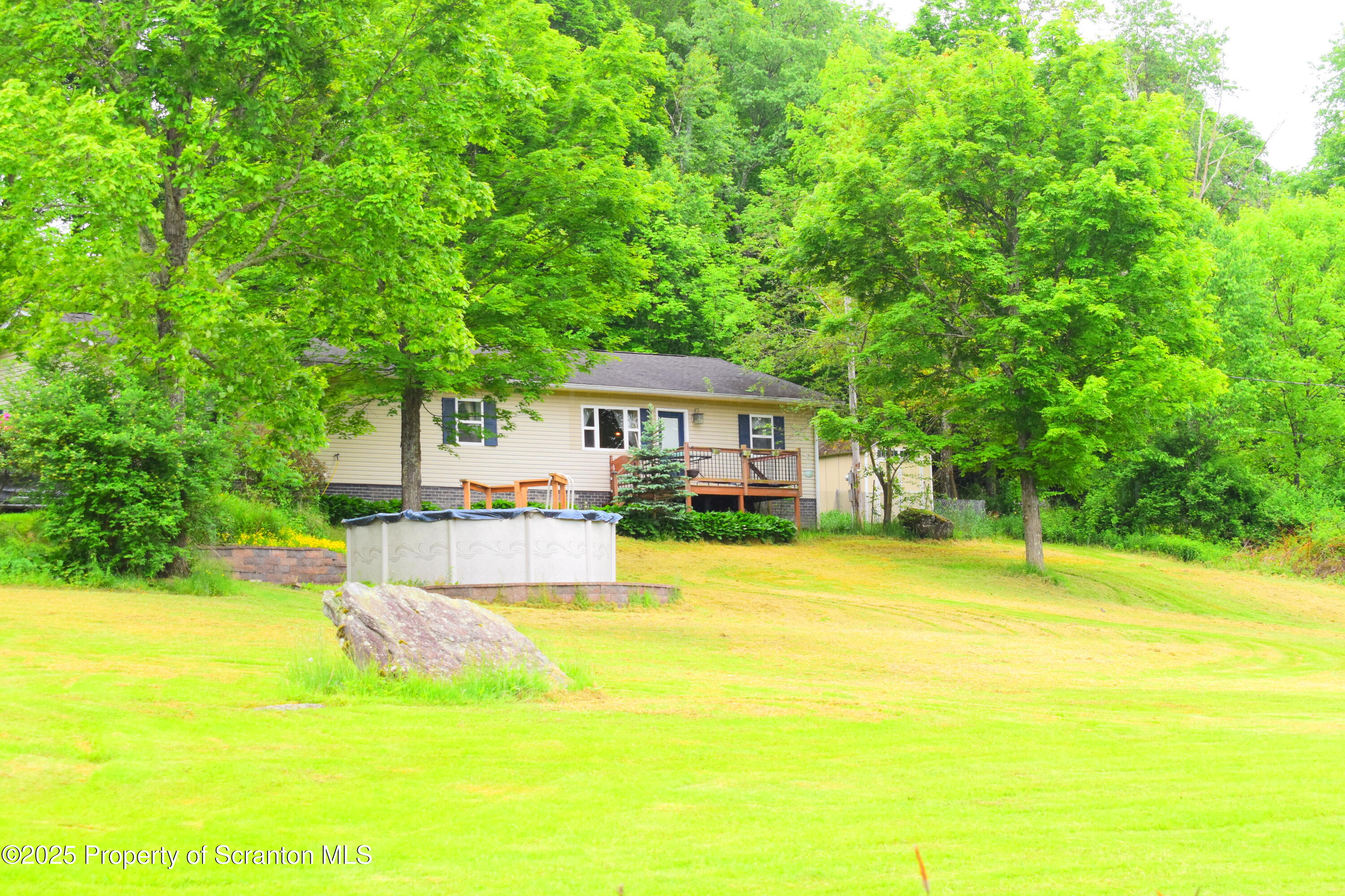 760 State Rte 3021 Springville, PA 18844 - Photo 1 of 26 a front view of house with yard and swimming pool