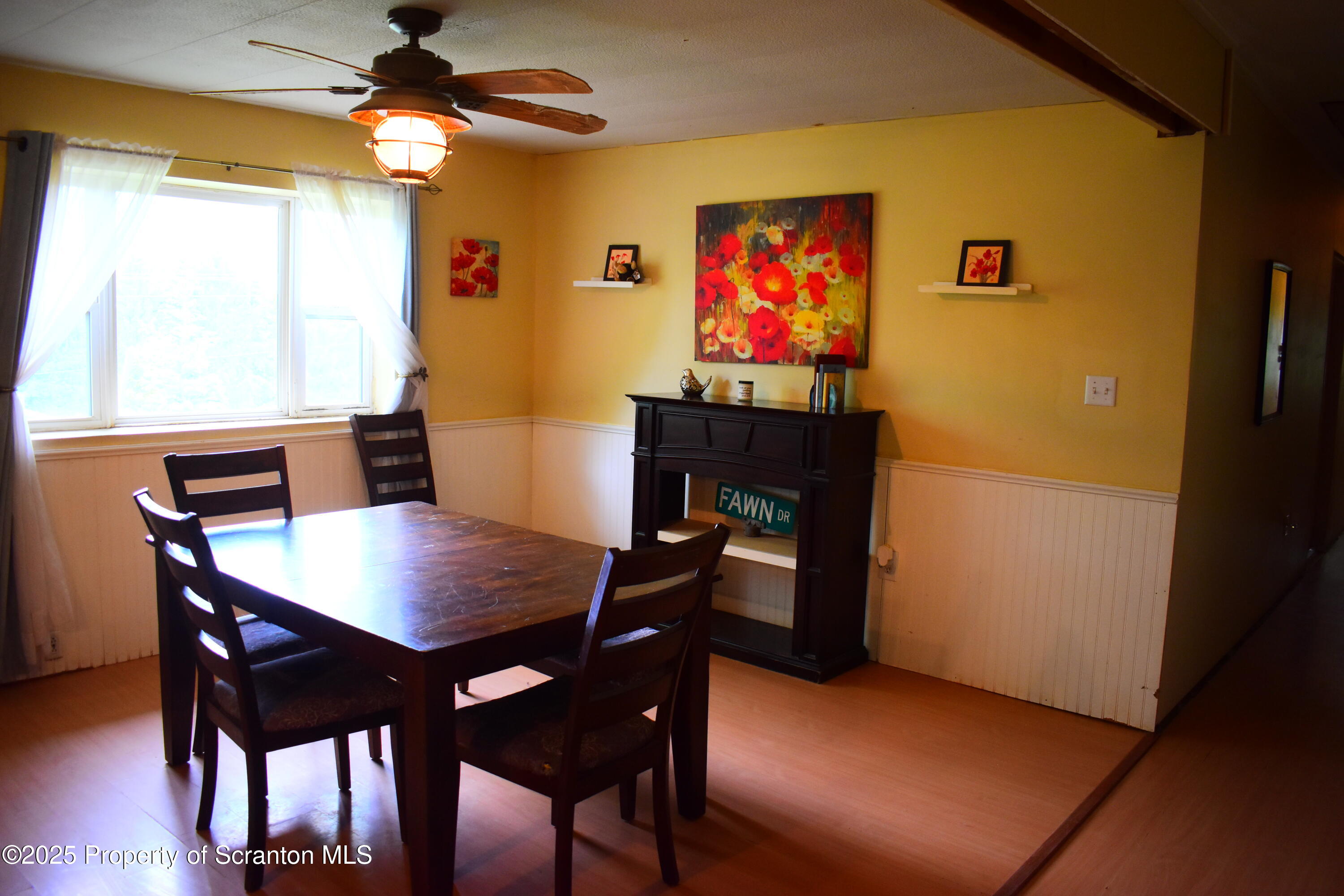 760 State Rte 3021 Springville, PA 18844 - Photo 26 of 26 a view of a dining room with furniture and a chandelier