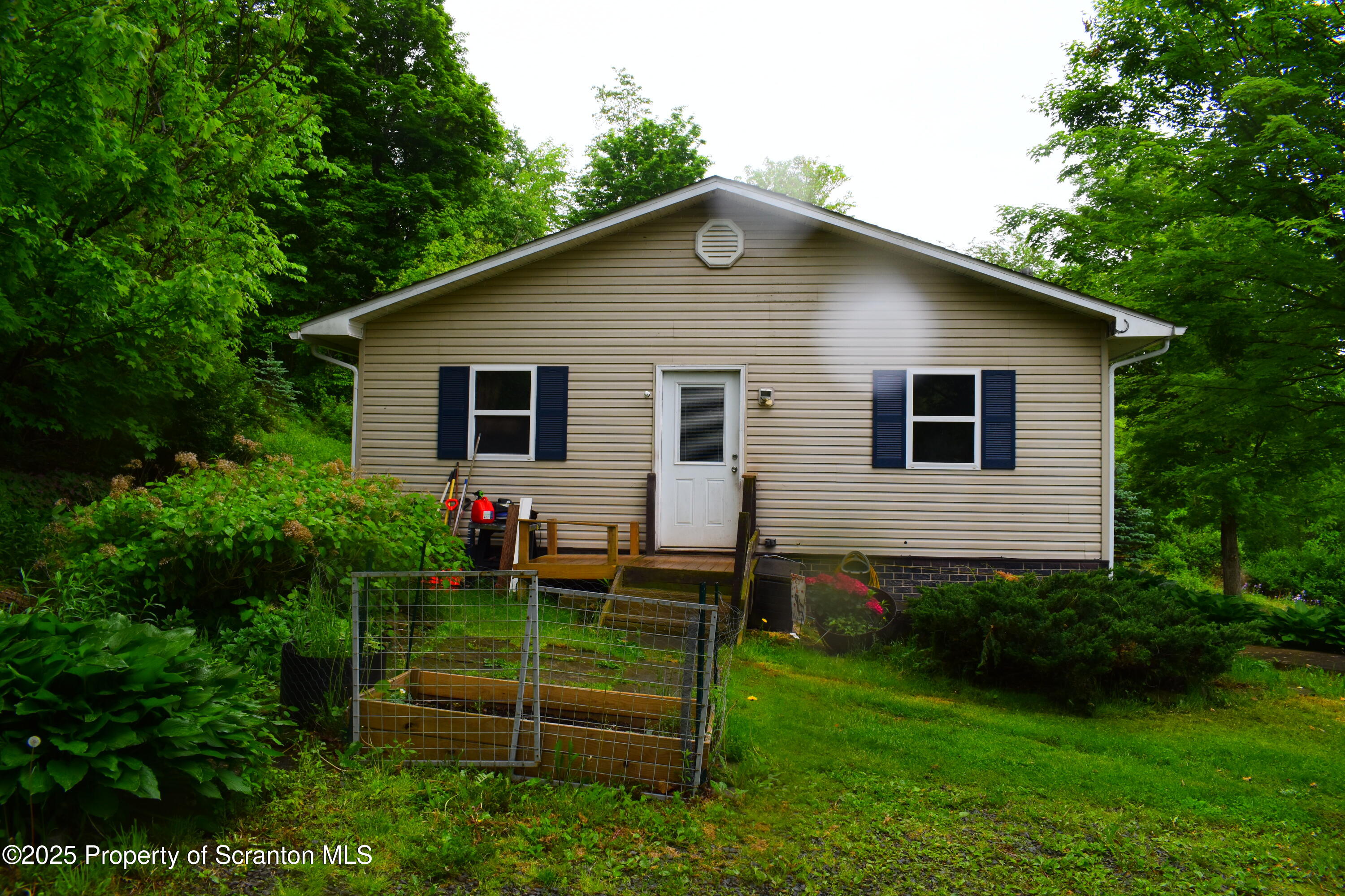 760 State Rte 3021 Springville, PA 18844 - Photo 10 of 26 a front view of a house with a yard