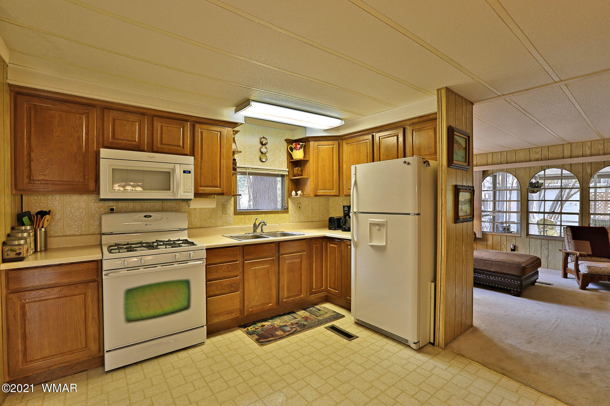 4308 Racoon Court Pinetop, AZ 85935 - Photo 7 of 14 a kitchen with stainless steel appliances granite countertop a refrigerator a stove top oven a sink and dishwasher