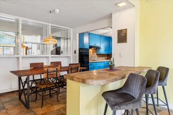a view of kitchen with cabinets and wooden floor