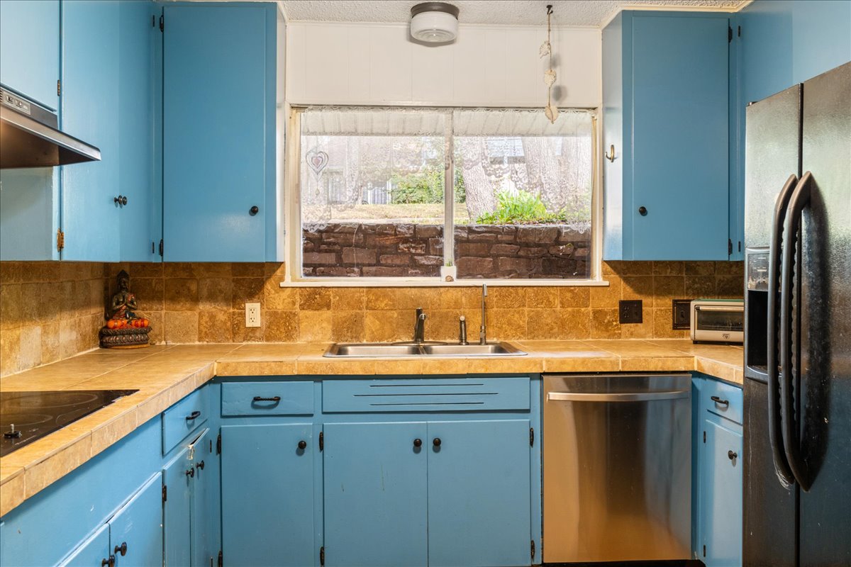 209 Finn Street Austin, TX 78734 - Photo 14 of 40 Laundry room is to the right of the kitchen