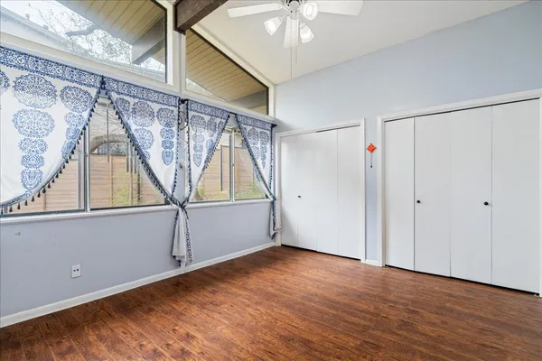 a view of room with window and hardwood floor