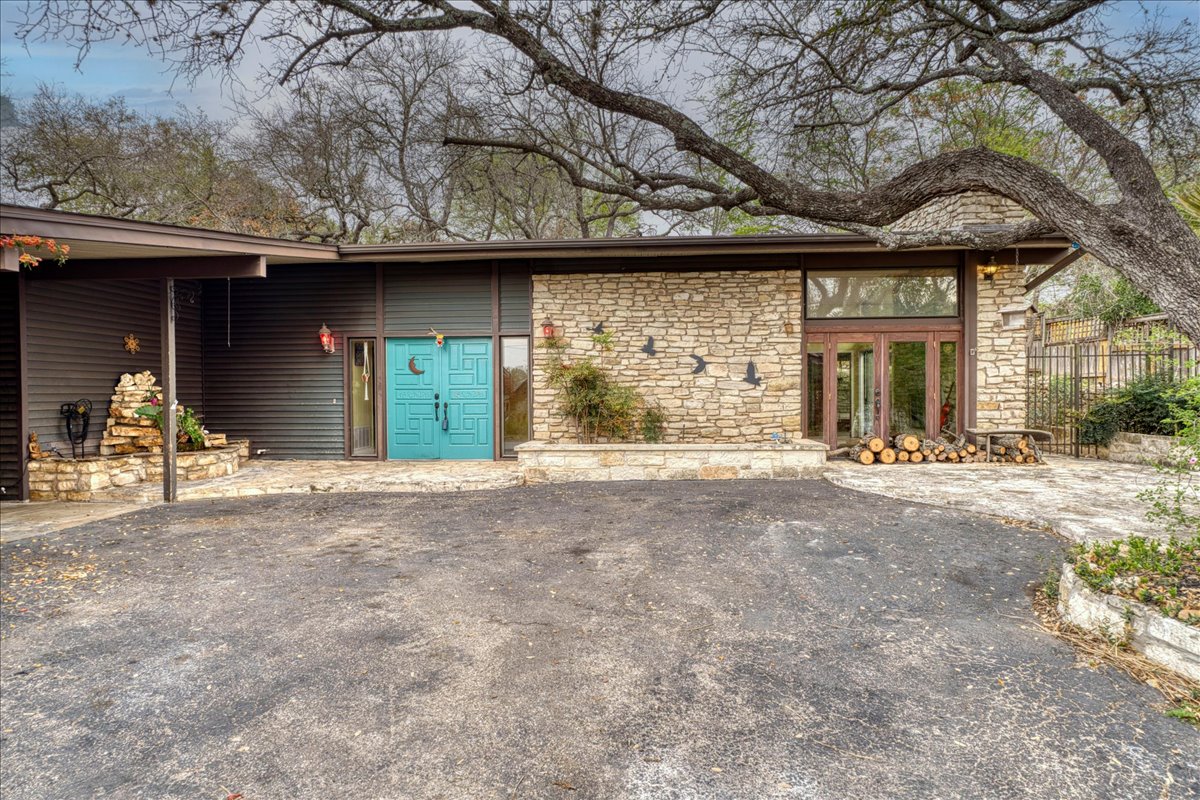 209 Finn Street Austin, TX 78734 - Photo 2 of 40 2 vehicle carport with closet storage to the left