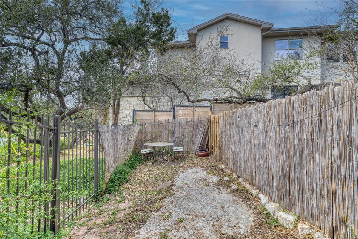 209 Finn Street Austin, TX 78734 - Photo 22 of 40 View of private yard to 3rd bedroom with access to front yard. VERY private! Perfect for roommates!