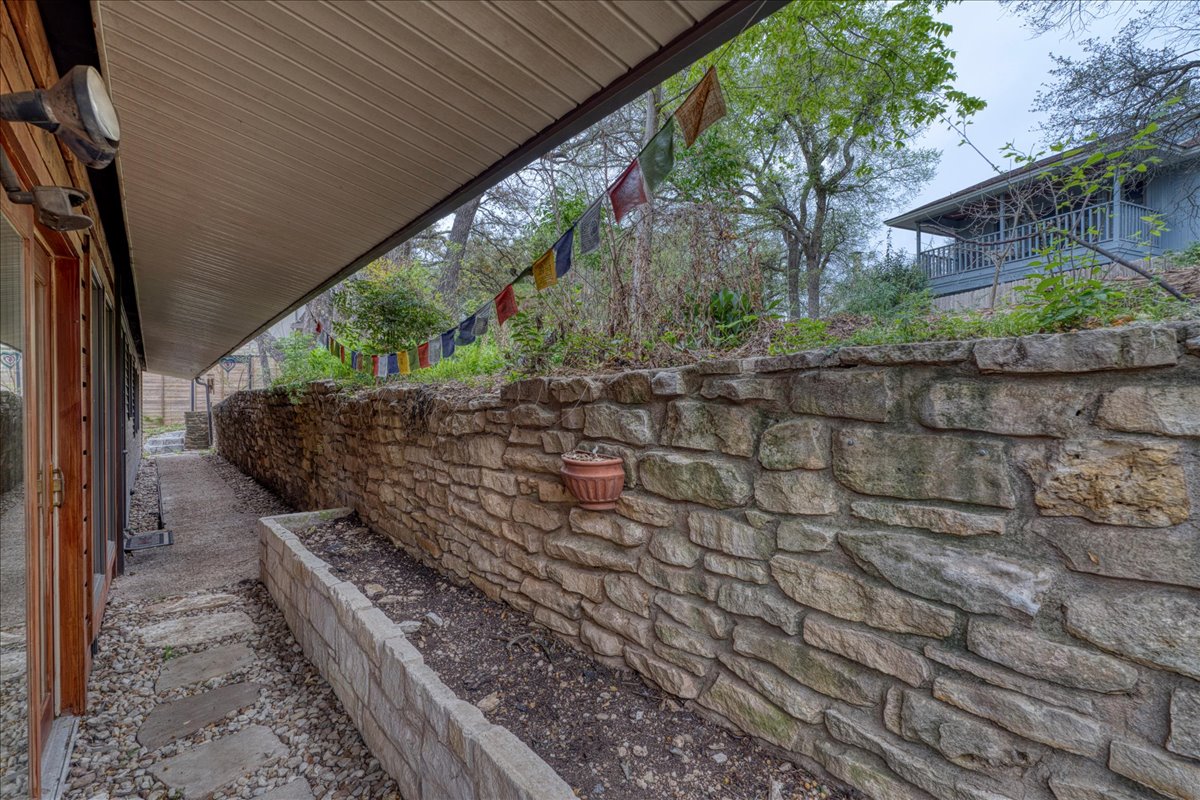 209 Finn Street Austin, TX 78734 - Photo 23 of 40 Laundry room door leads to covered space in backyard