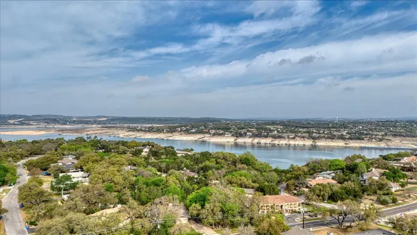 an aerial view of a house with a garden