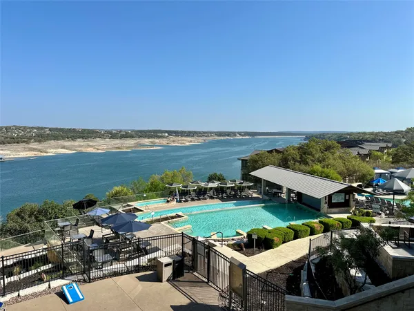 a view of a lake with a car parked