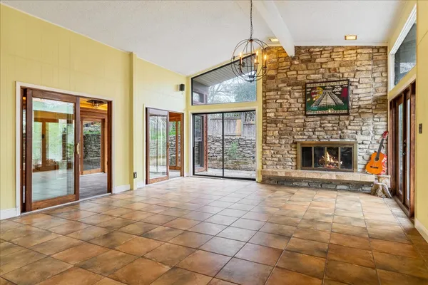 a view of an empty room with glass door