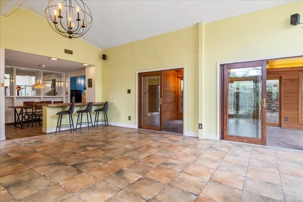 a view of a livingroom with furniture play table and chairs