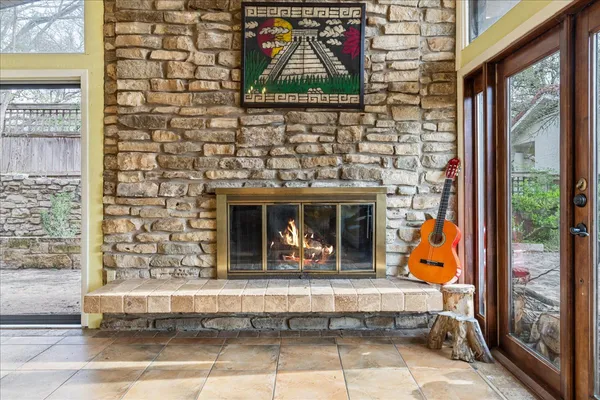 a living room with fireplace furniture and a flat screen tv