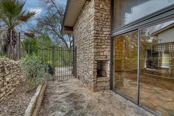 a view of a glass door with a yard