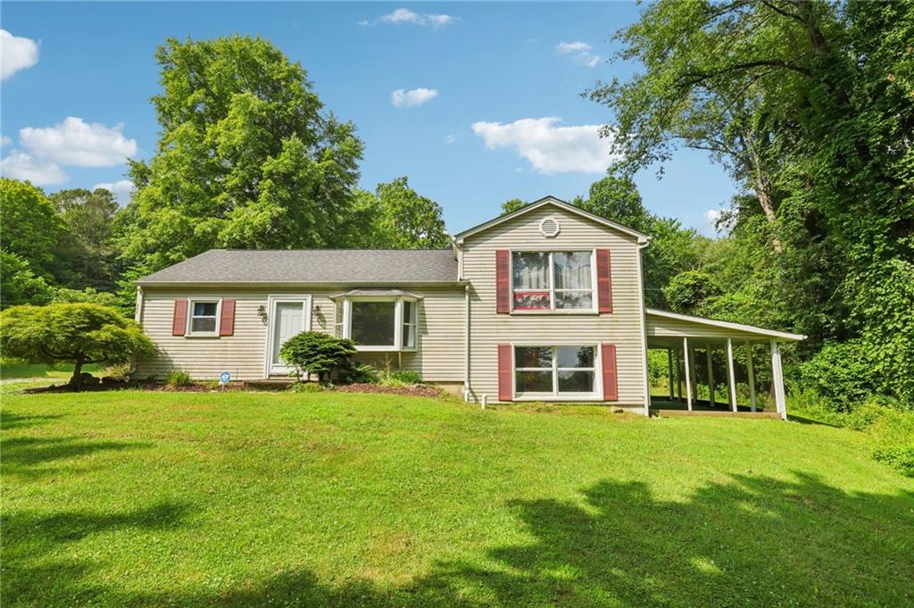 3425 Mercer Road New Castle, PA 16105 - Photo 1 of 38 a front view of a house with a garden