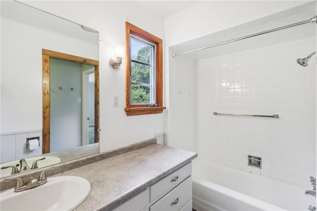 3425 Mercer Road New Castle, PA 16105 - Photo 18 of 38 a bathroom with a granite countertop sink mirror and a bathtub