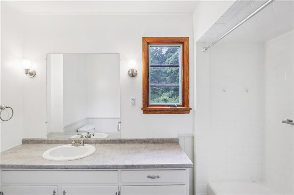 3425 Mercer Road New Castle, PA 16105 - Photo 19 of 38 a bathroom with a granite countertop sink and a mirror