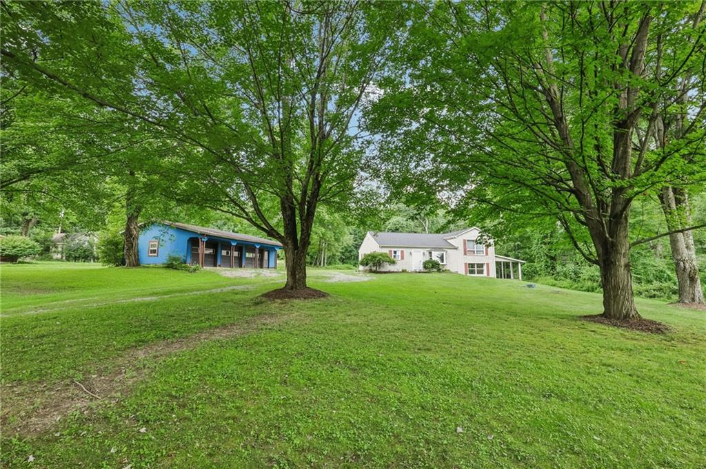3425 Mercer Road New Castle, PA 16105 - Photo 2 of 38 a front view of a house with a garden