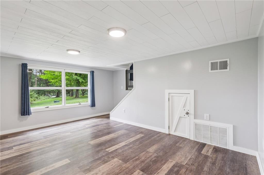 3425 Mercer Road New Castle, PA 16105 - Photo 27 of 38 a view of empty room with wooden floor and fan