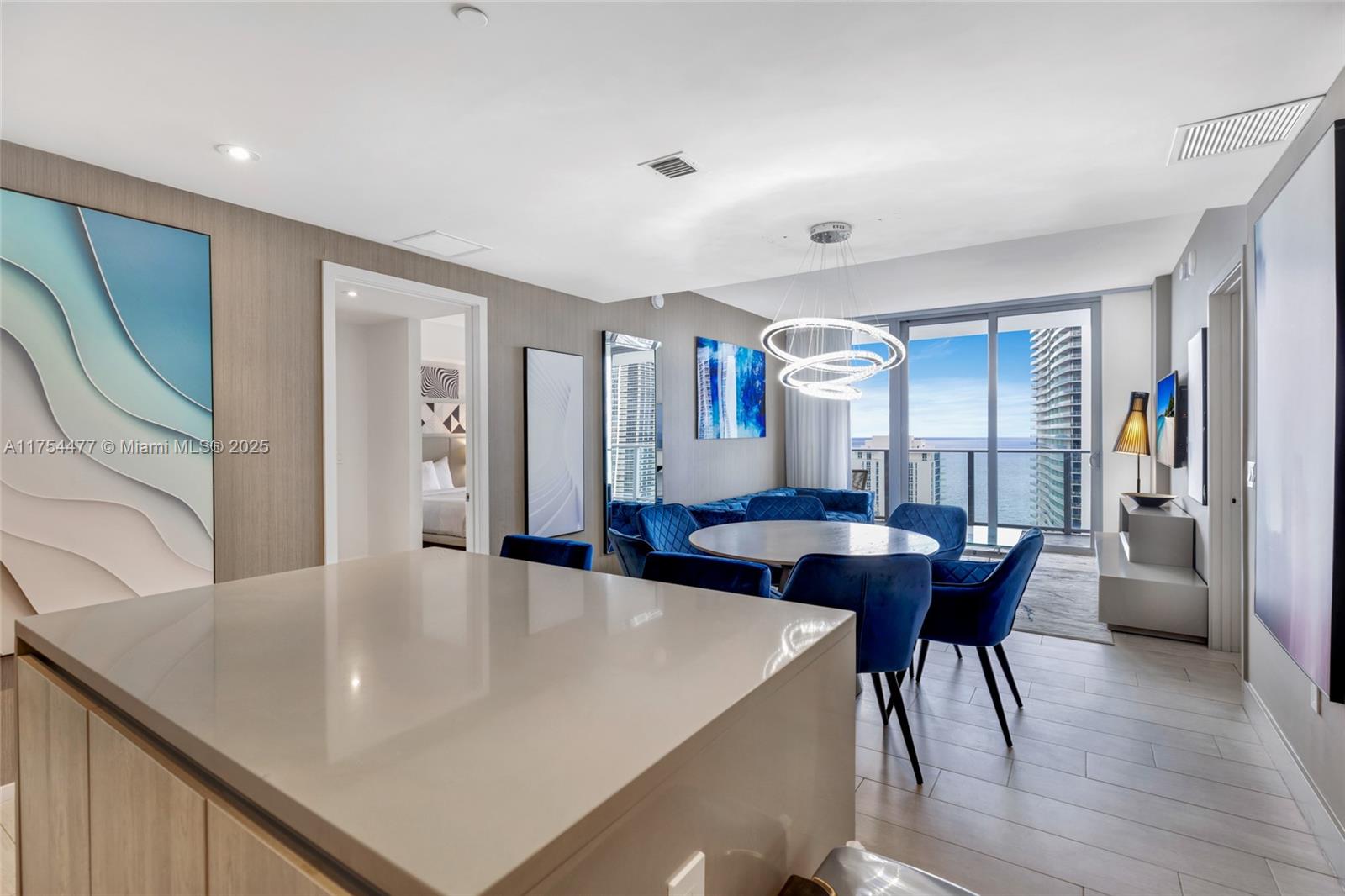 4010 South Ocean Drive, Unit R2505 Hollywood, FL 33019 - Photo 19 of 29 a view of a dining room with furniture and wooden floor