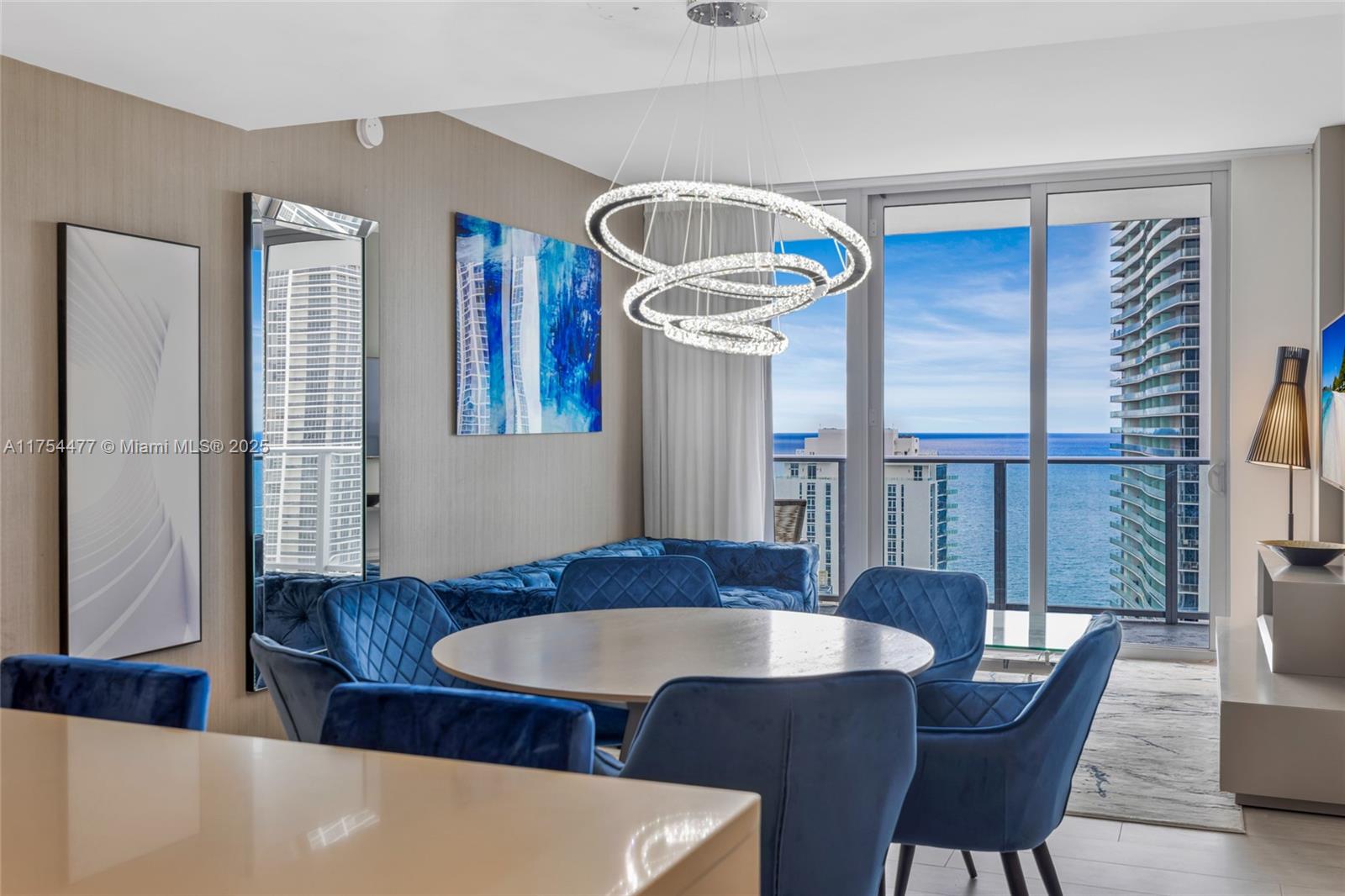 4010 South Ocean Drive, Unit R2505 Hollywood, FL 33019 - Photo 20 of 29 a view of a dining room with furniture and wooden floor