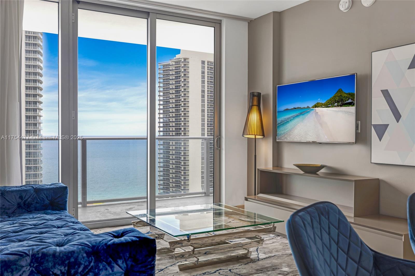 4010 South Ocean Drive, Unit R2505 Hollywood, FL 33019 - Photo 21 of 29 a bedroom with a bed and a dresser next to a window