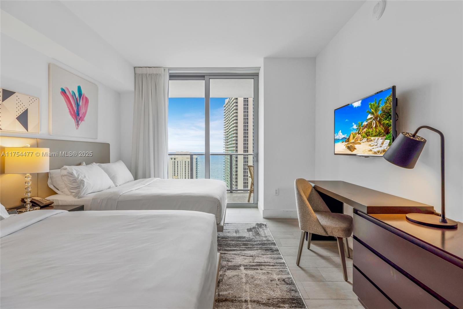 4010 South Ocean Drive, Unit R2505 Hollywood, FL 33019 - Photo 6 of 29 a bedroom with a bed and a dresser