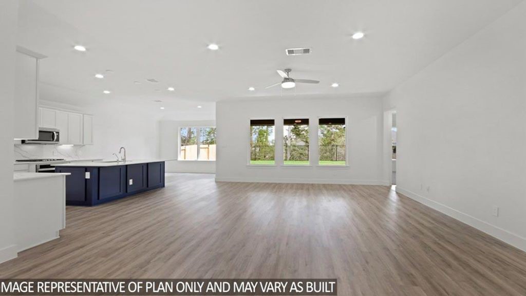 15219 Riverside Drive Baytown, TX 77523 - Photo 2 of 14 an empty room with wooden floor and windows