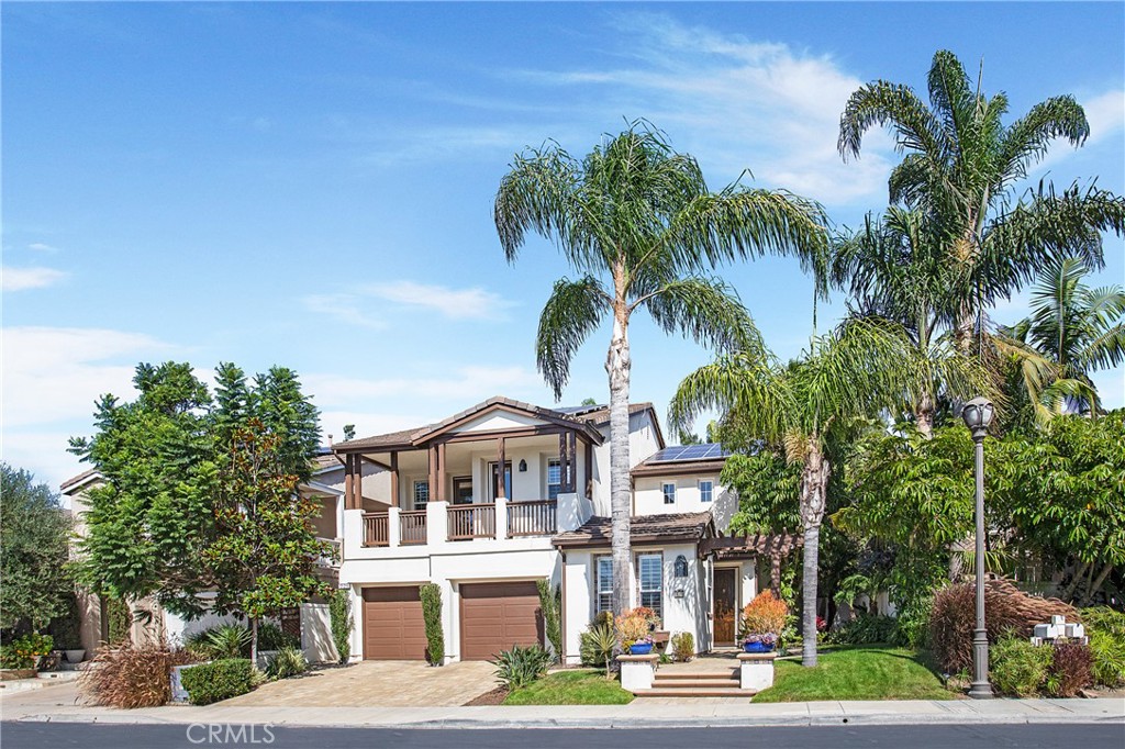 a front view of multiple houses with yard