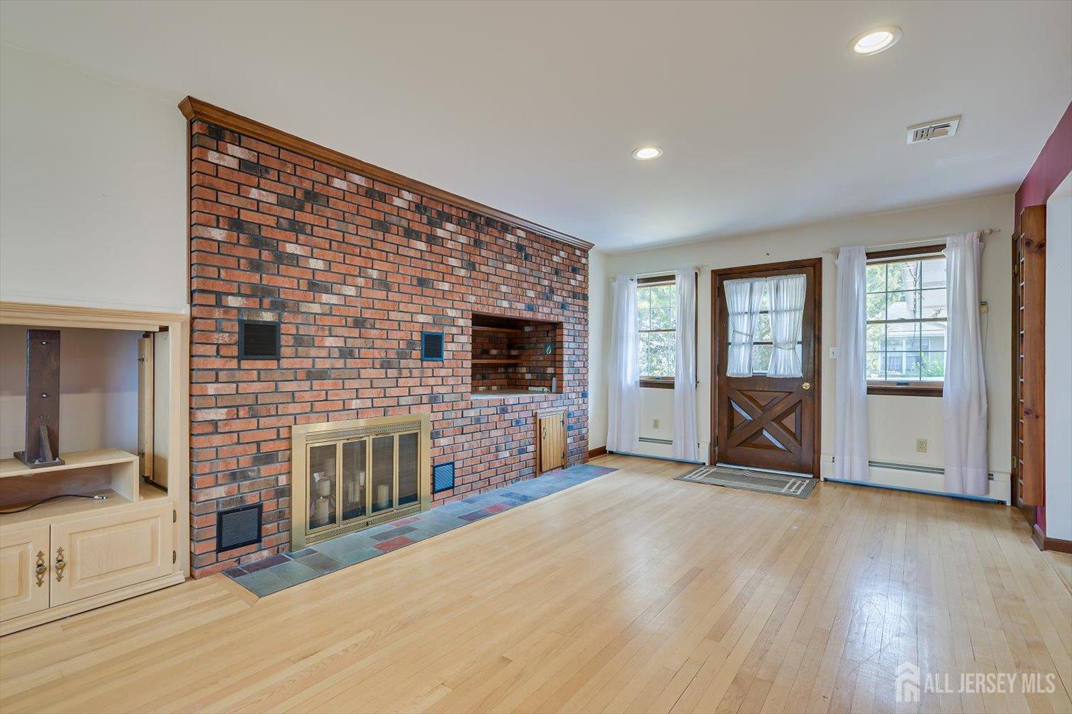 17 Bartha Avenue Edison, NJ 08817 - Photo 12 of 25 an empty room with furniture and a fireplace