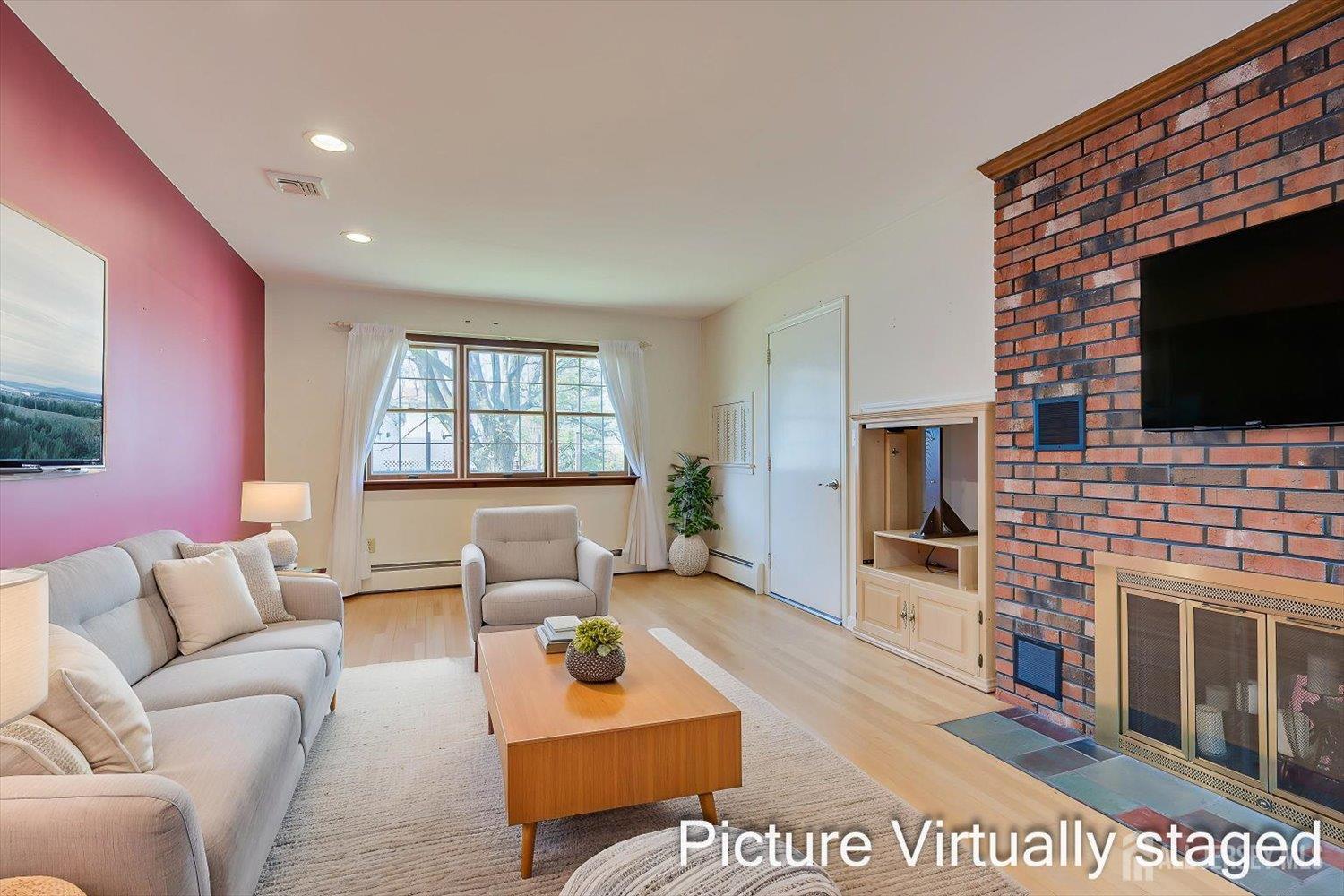 17 Bartha Avenue Edison, NJ 08817 - Photo 13 of 25 a living room with furniture a flat screen tv and a fireplace