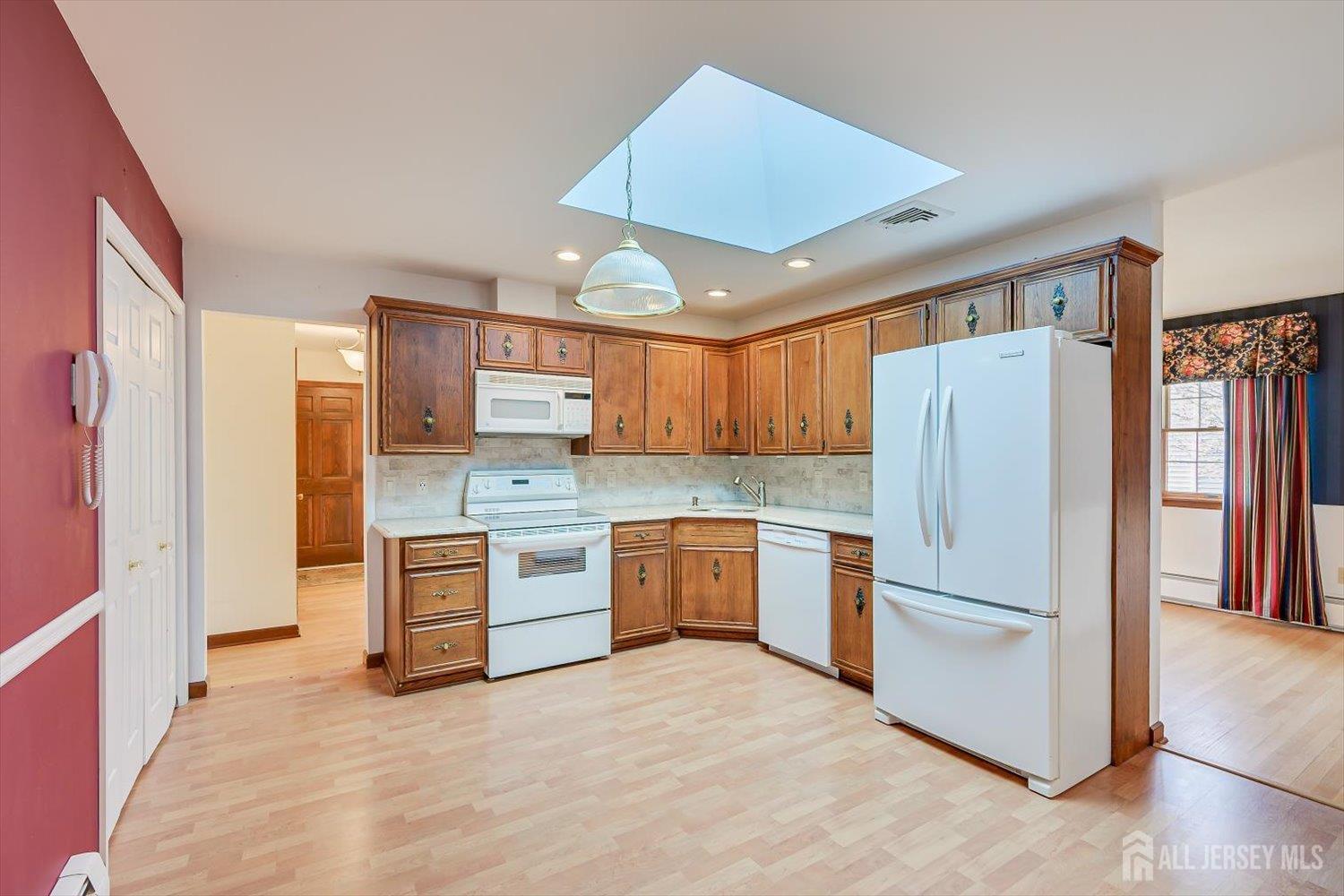 17 Bartha Avenue Edison, NJ 08817 - Photo 9 of 25 a kitchen with a refrigerator and a stove top oven