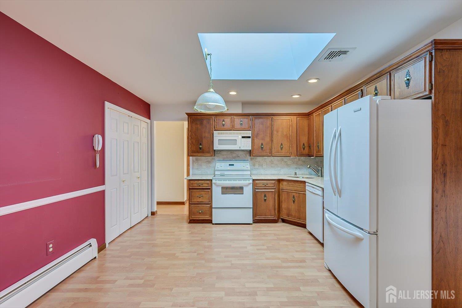17 Bartha Avenue Edison, NJ 08817 - Photo 10 of 25 a kitchen with a refrigerator and a sink