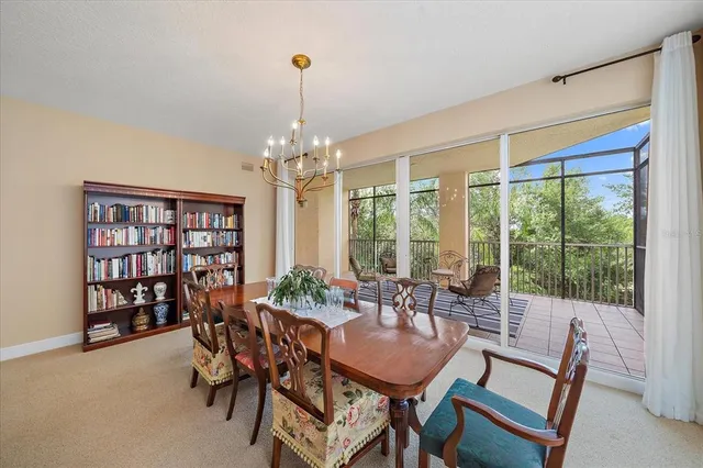 a view of a dining room with furniture window and outside view