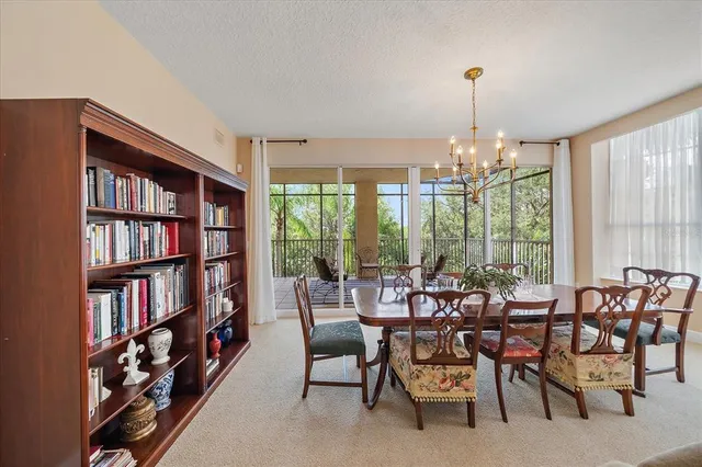 a room with lots of furniture and a book shelf