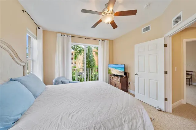 a spacious bathroom with a granite countertop sink toilet a large mirror a bathtub and shower