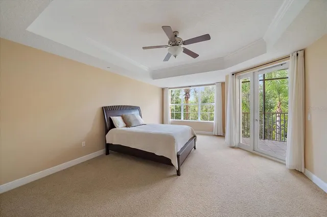 a spacious bedroom with a bed and a window